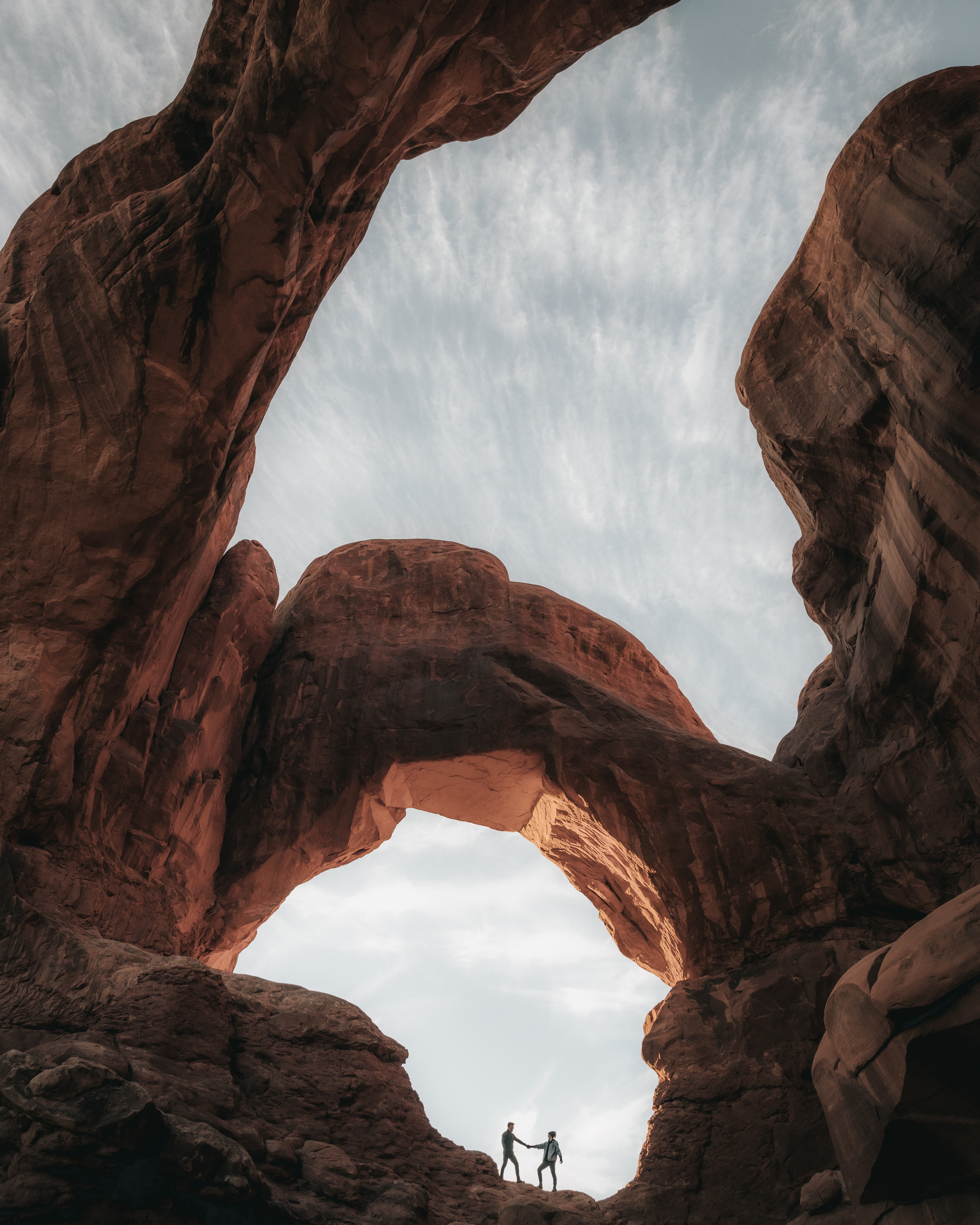 Couple Touch Canyon Rocks